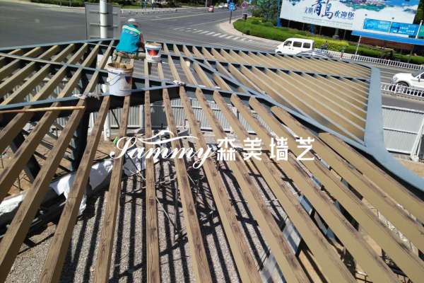 青島膠州市時代國際中心鋼構造型廊架木紋漆施